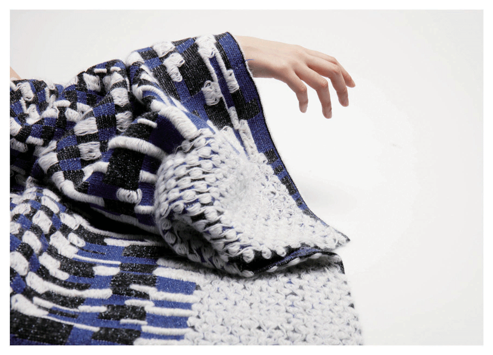 Detail of a large sleeve made from a woven fabric in blue, black and white