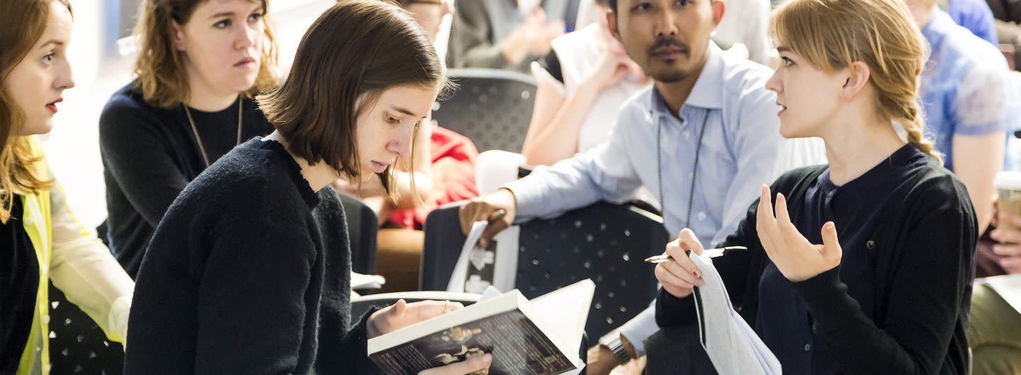  A group of students discussing animatedly