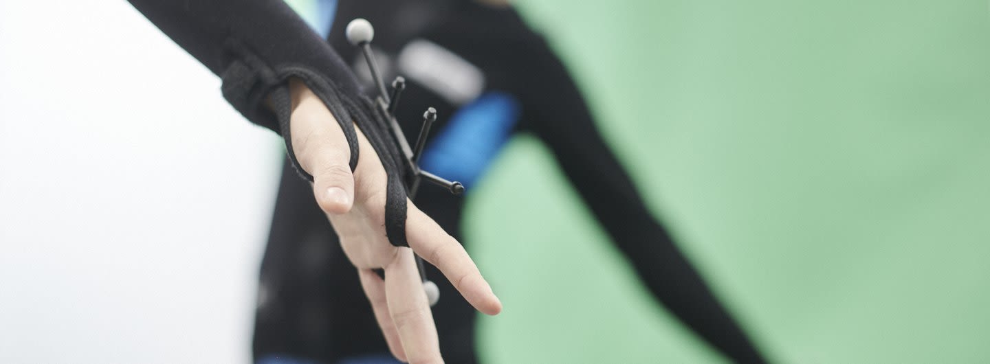 Close up detail of a hand in a motion capture suit