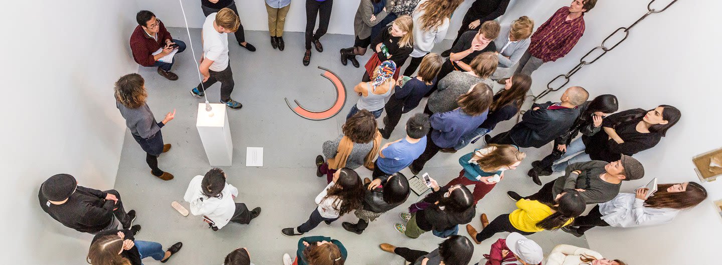 Arial view of a crowd in a painting exhibition